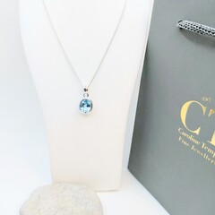 Oval Sky blue topaz bezel pendant