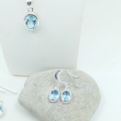 Small oval bezel sky blue topaz drop earrings